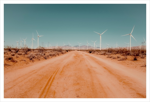 Wind turbine in the desert with sandy road at Kern County California USA Art Print by Timmy333