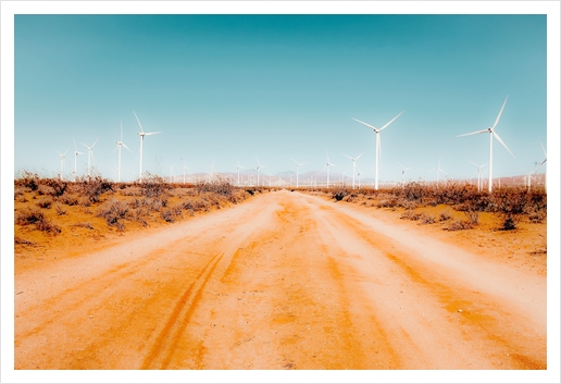 Wind turbine and sandy road desert with blue sky in California USA Art Print by Timmy333