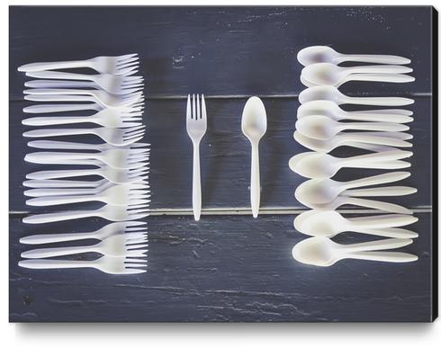 plastic forks and plastic spoons with wooden table Canvas Print by Timmy333