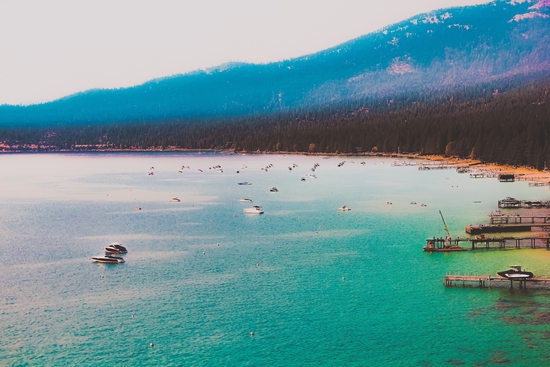 Boat on the water and mountain background at Lake Tahoe Nevada USA by Timmy333