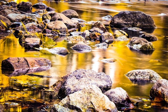 rock and stone in the river with the summer sunset light by Timmy333